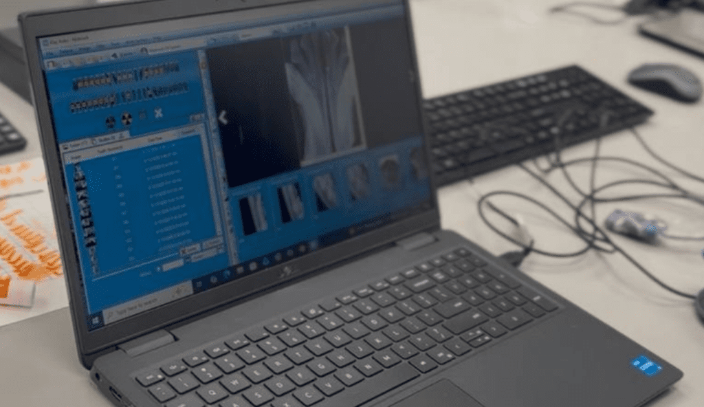 Veterinary digital radiography software displaying pet X-ray images on a laptop at FurlifeVets in Delray Beach, Florida.